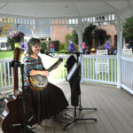 Sandy Lusco Huffman provides musical accompanyment